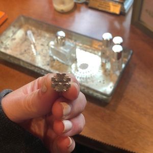 One Tory Burch earring